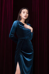 Velvet evening gown with draped neckline and thigh-high slit in long sleeve floor-length design